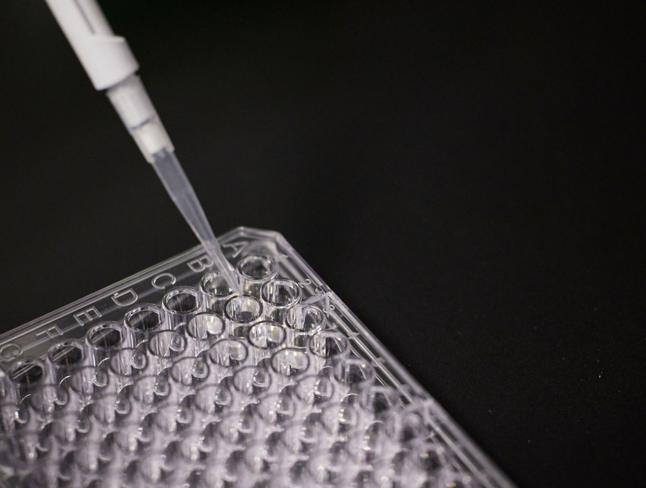 Close up of pipette on black background