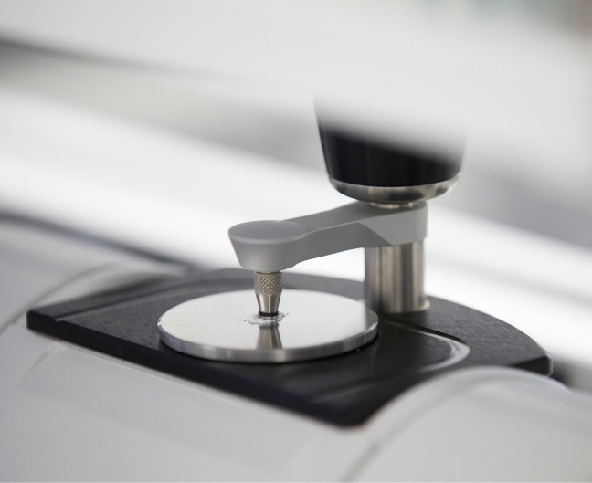  Close up of Fourier Transform Infrared Spectroscopy (FTIR) test being performed in QC lab
